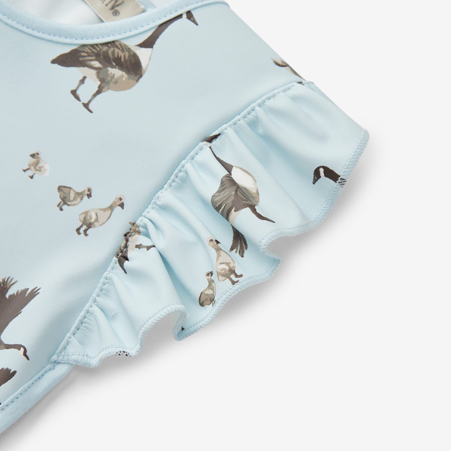 Goose Ruffle Pocket Bib