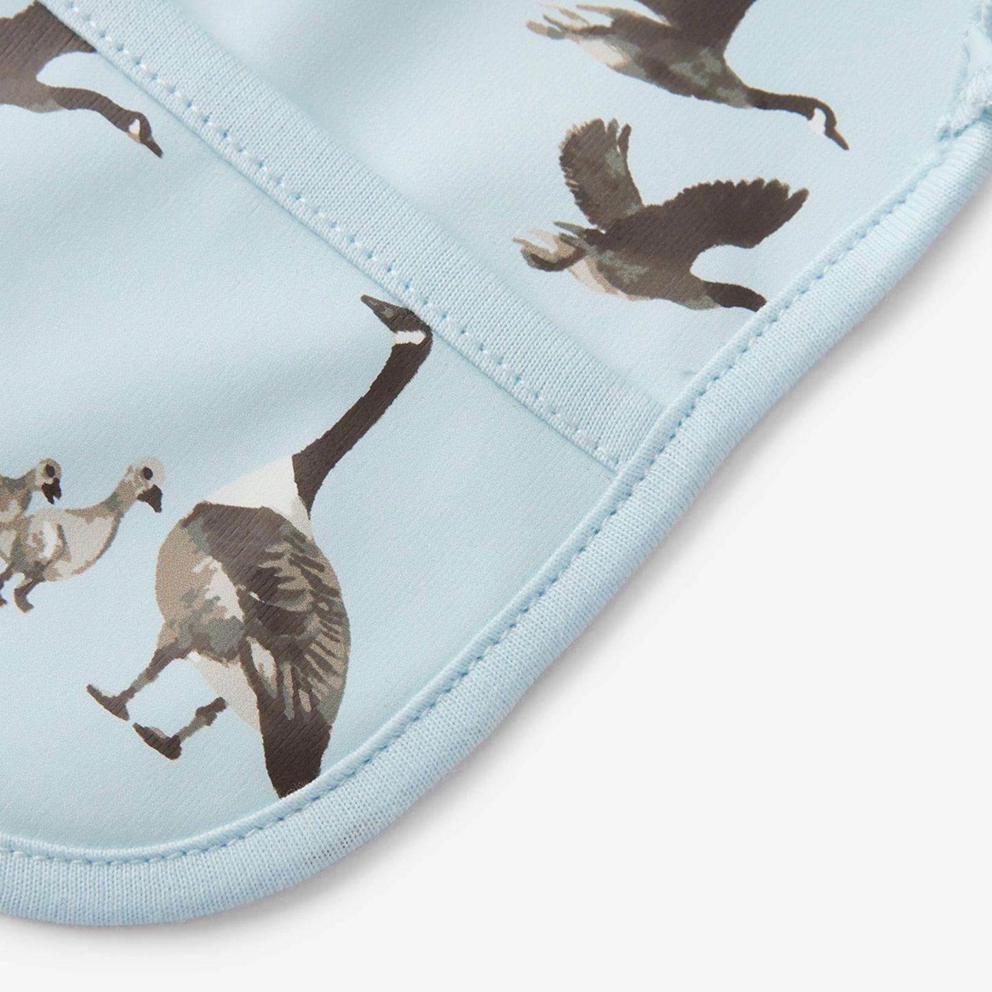 Goose Ruffle Pocket Bib