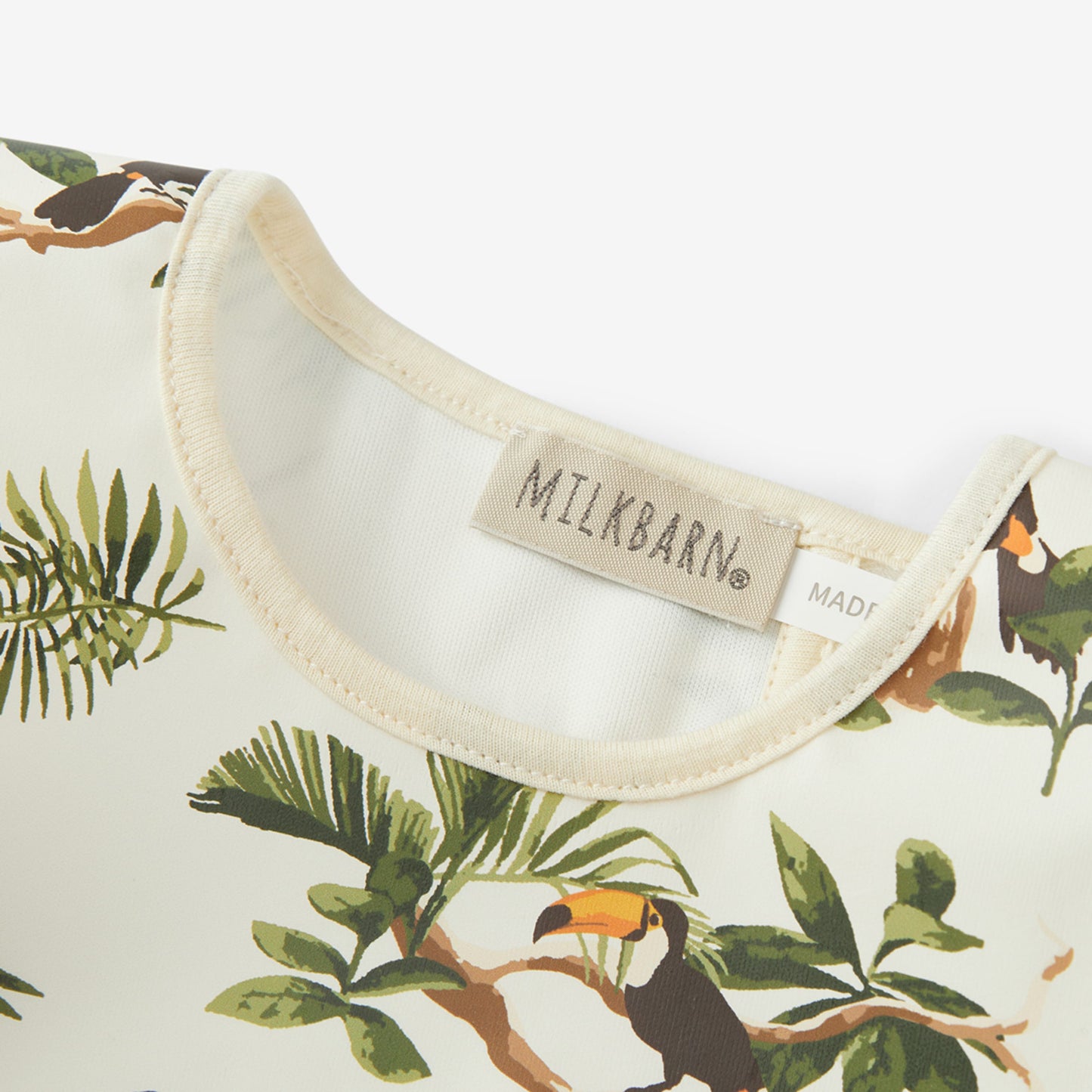 White Toucan Ruffle Pocket Bib