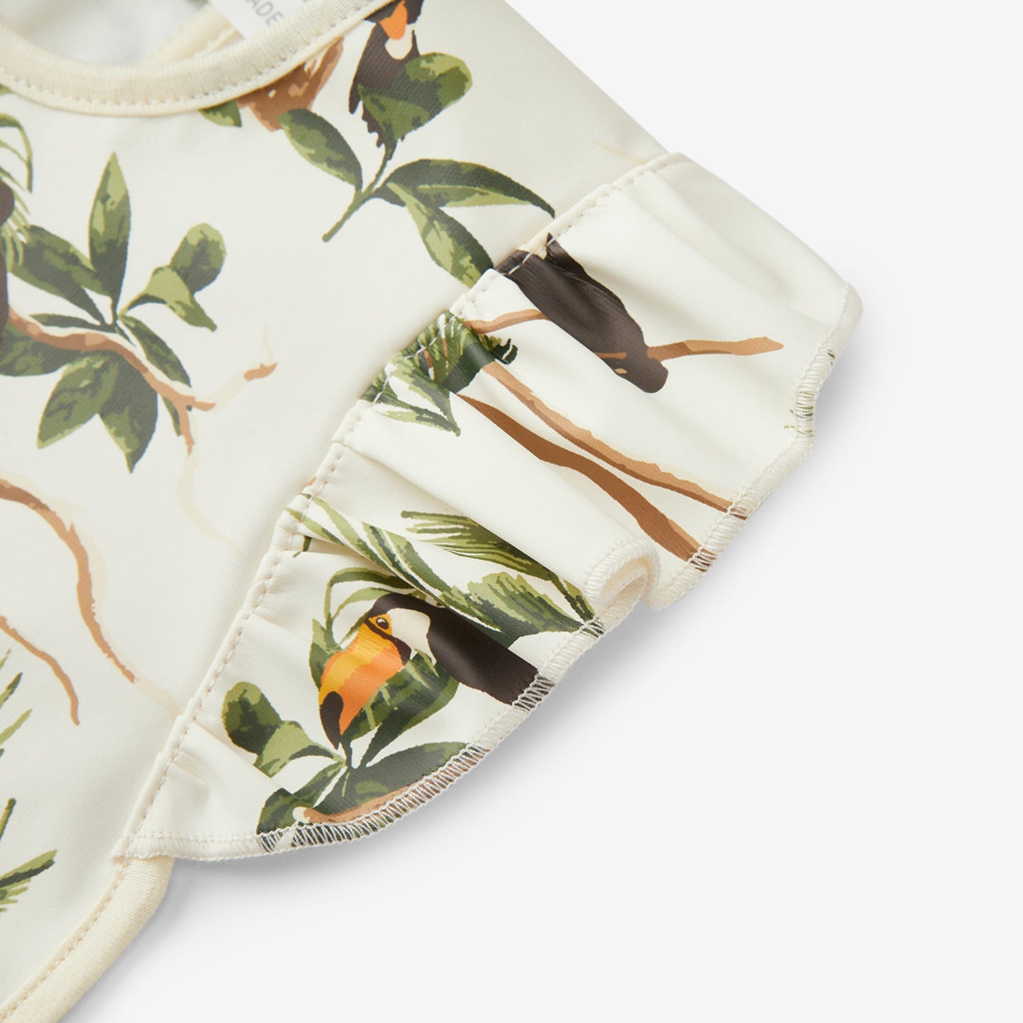 White Toucan Ruffle Pocket Bib