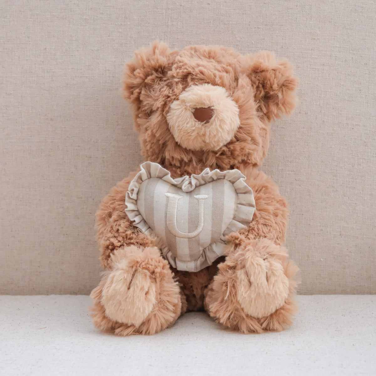 INITIAL TEDDY