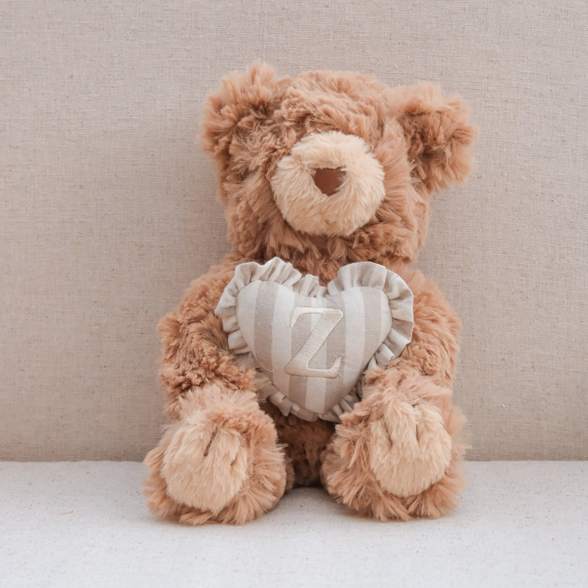 INITIAL TEDDY